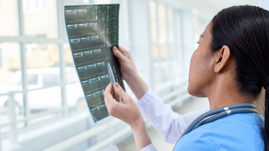 Doctors discussing to diagnose from imaging report